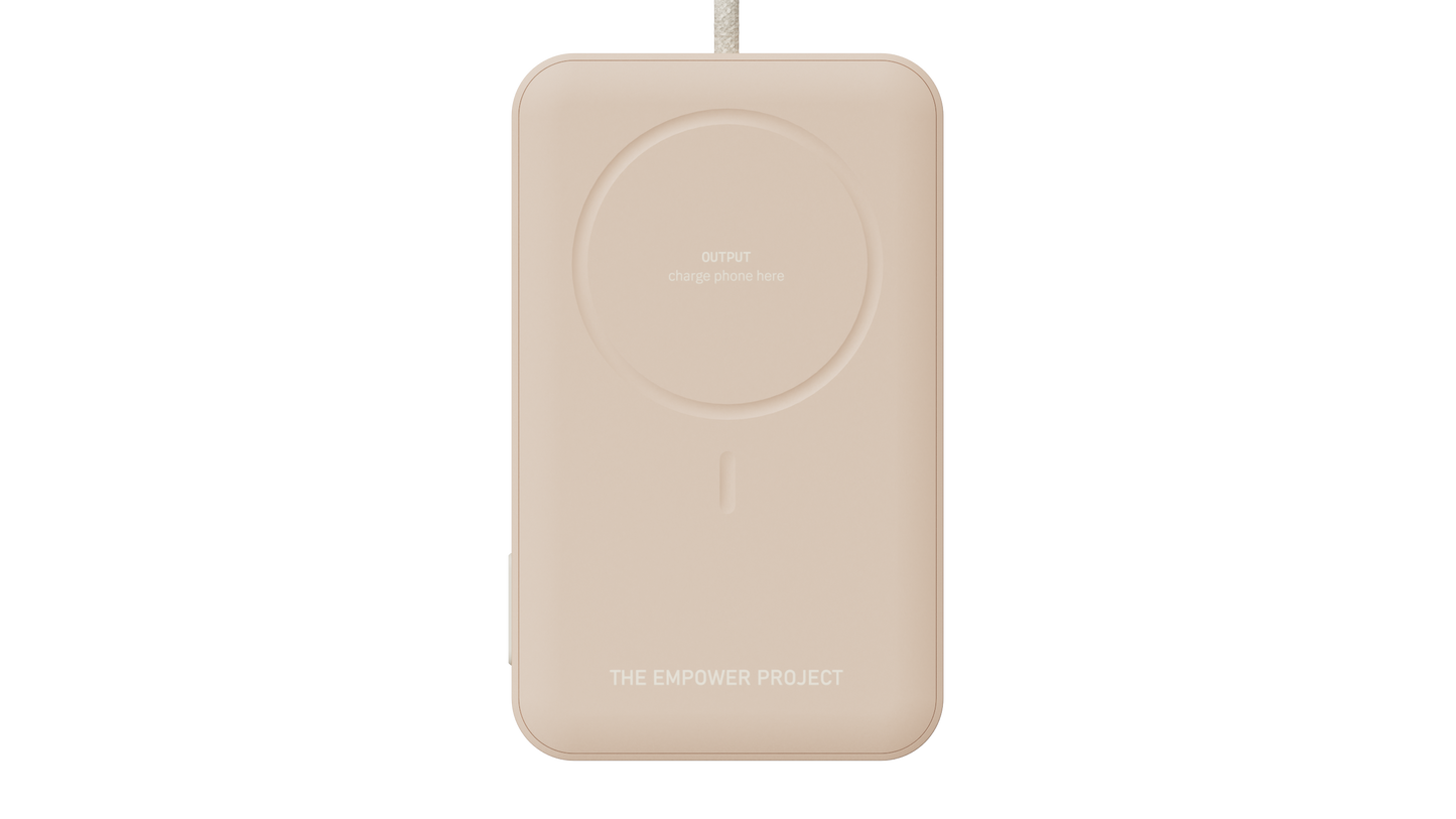 Wireless charging dock for qi-compatible phones and the empower battery pack, shown here in a coral sand color finish